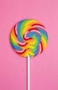 Beautiful Rainbow Lollipop on a pink background Royalty Free Stock Photo