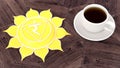 ÃÂ¡up of coffee on a wooden table. Morning Chakra Meditation. Manipura symbol 3d illustration