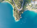 Up and down drone aerial view of the lake Ledro. A natural alpine lake. Amazing turquoise, green and blue natural colors Royalty Free Stock Photo