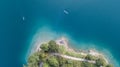 Up and down drone aerial view of the lake Ledro. A natural alpine lake. Amazing turquoise, green and blue natural colors Royalty Free Stock Photo