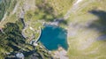 Up and down drone aerial view of the small and lower Lake Barbellino an alpine artificial lake. Italian Alps. Italy