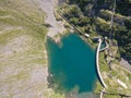 Up and down drone aerial view of the small and lower Lake Barbellino an alpine artificial lake. Italian Alps. Italy