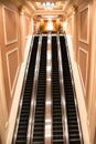 Up and down escalators inside unknown hotel lobby Royalty Free Stock Photo