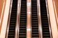 Up and down escalators inside unknown hotel lobby Royalty Free Stock Photo