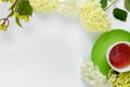 ÃÂ¡up of hot tea with bouquet of hydrangea on white background