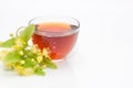 ÃÂ¡up of tea with a sprig of flowering linden