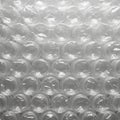 Up of transparent bubble wrap featuring a grid of air filled Royalty Free Stock Photo