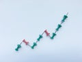 Up trend of graph data by green and red pin isolate on white background Royalty Free Stock Photo