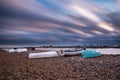 Up turned row boats on a stoney beach Royalty Free Stock Photo