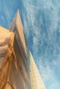 Up view on modern business office building and sky on the background. Urban exterior and tall perspective. Royalty Free Stock Photo