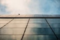 Up view on modern business office building and sky on the background. Urban exterior and tall perspective. Royalty Free Stock Photo