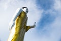 Up view Standing Buddha and raise the right hand. Royalty Free Stock Photo