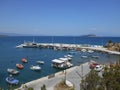 Up view to sea dock and fishing boats on sea in Olympiada, Greece