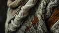 An upclose view of a handknitted sweater with embedded heating elements providing both warmth and a striking visual