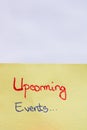 Upcoming events handwriting text close up isolated on yellow paper with copy space Royalty Free Stock Photo