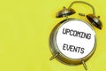 UPCOMING EVENTS on old alarm colck screen Royalty Free Stock Photo