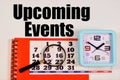 Upcoming events. Text label on the background of the clock and calendar. Royalty Free Stock Photo