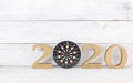 Upcoming 2020 New Year with Dartboard over white wood background, Target and Mission Conccept Royalty Free Stock Photo