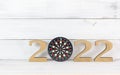 Upcoming 2022 New Year with Dartboard over white wood background, Target and Mission Conccept Royalty Free Stock Photo