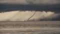 Upcoming storm with tornado hitting the water at lake malawi