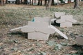 Upcycling ideas, Recycle crafts. Toy airplane made from cardboard boxes on grass. DIY Creative cardboard paper ideas for