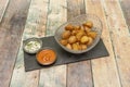 Updated version of fried patatas bravas with the skin and accompanied by spicy sauce and mayonnaise Royalty Free Stock Photo