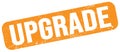 UPGRADE text on orange grungy stamp sign