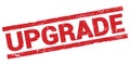 UPGRADE text on red rectangle stamp sign