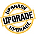 UPGRADE text on yellow-black round stamp sign