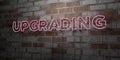 UPGRADING - Glowing Neon Sign on stonework wall - 3D rendered royalty free stock illustration