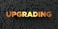 Upgrading - Gold text on black background - 3D rendered royalty free stock picture