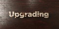 Upgrading - grungy wooden headline on Maple - 3D rendered royalty free stock image