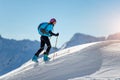 Uphill girl with seal skins and ski mountaineering Royalty Free Stock Photo