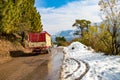 Uphill road in winter at banikhet dalhousie himachal pradesh india with sideways full of snow. Scenic winter view from the asphalt Royalty Free Stock Photo