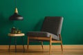 Upholstered chair by green wall