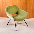 Upholstered green velvet curved vintage armchair