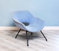 Upholstered vintage blue velvet armchair Royalty Free Stock Photo