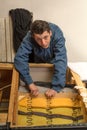 Upholsterer padding a sofa Royalty Free Stock Photo
