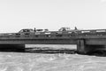 Sightseers on bridge over flooded Orange River, Upington. Monochrome