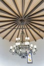 Uplight wrought iron chandelier on a round ceiling at San Clemente, California Royalty Free Stock Photo