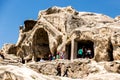 Uplistsikhe, Georgia - June 14, 2016: Tourists visiting Ancient Cave Town Uplistsikhe in Georgia