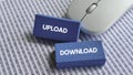 Upload and Download Text on Blue Blocks with Binary Code and Computer Mouse Representing Data Transfer and Internet Activity Royalty Free Stock Photo