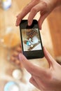 Uploading the baking tip of the week. a set of hands taking a picture of a group of ingredients.