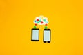uploading and downloading information from the cloud, creative art design with two mobile phones and the cloud