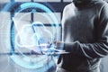 Uploading files to cloud concept. Close up of hacker hands using glowing digital cloud with arrow on blurry background. Double