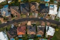 Upmarket houses aerial top down curved street, Australia