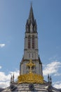 The Upper Basilica with gilded crown ad cross in Lourdes