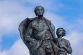 Upper body of man and boy at Emigrant Statue, Helmsdale, Scotland.