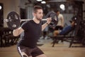 upper body shot, squat exercise, young man holding barbell with weights on back shoulders Royalty Free Stock Photo