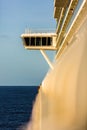 Upper captain deck on big luxury cruise view from balcony in sun